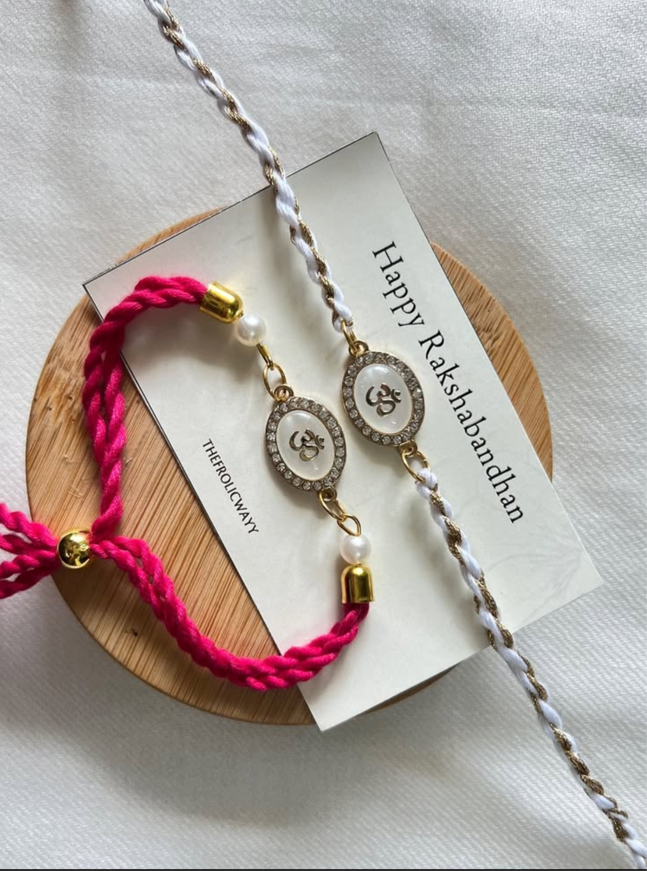 OM White Pink Couple Rakhi